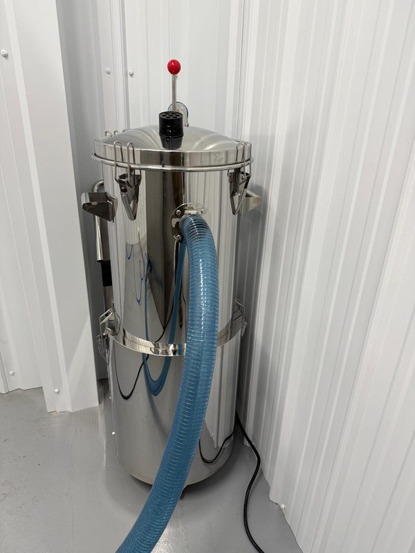 Dust collection unit ducted to the encapsulator