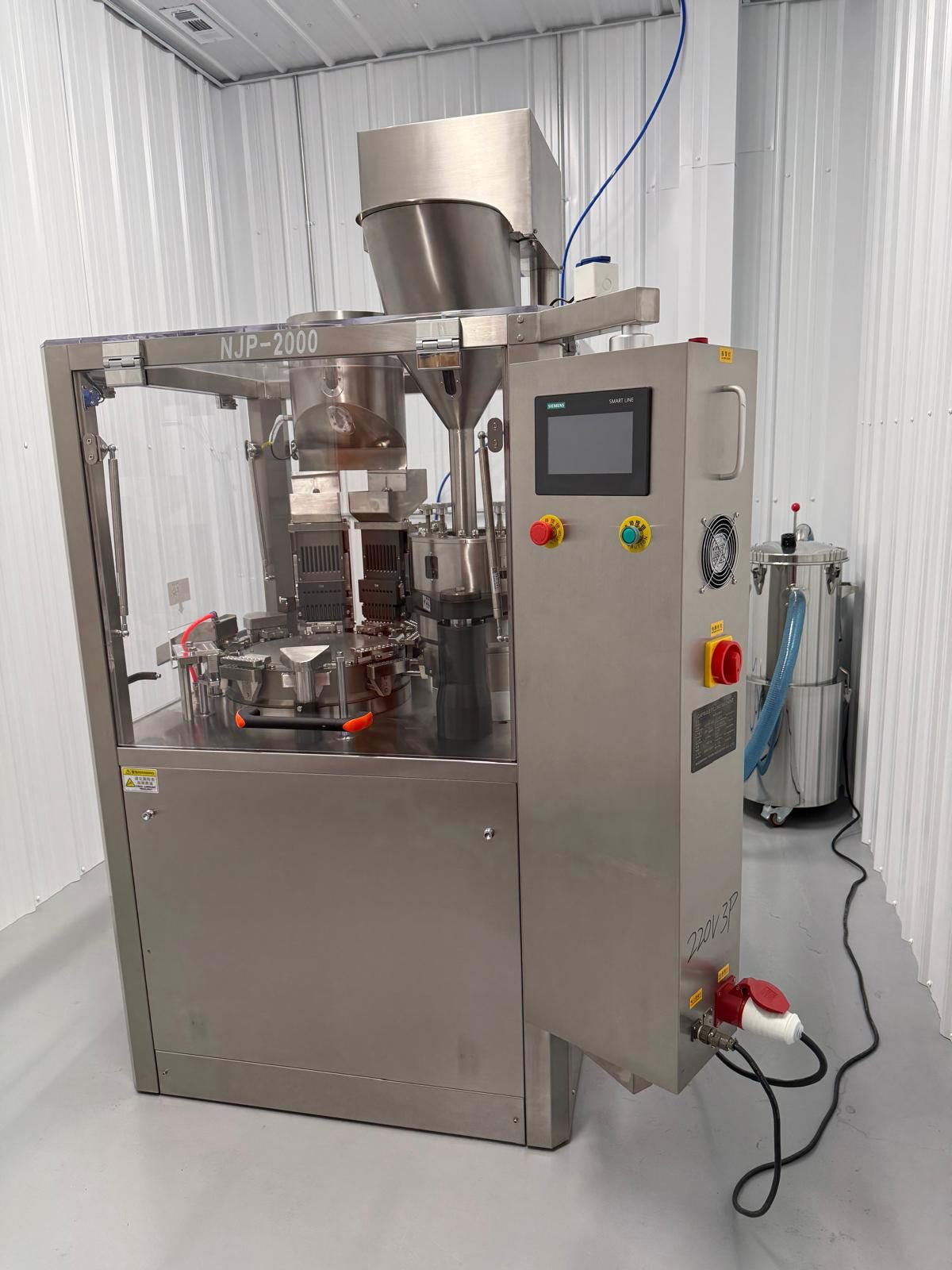 NJP-2000 automatic capsule filling machine with its control panel