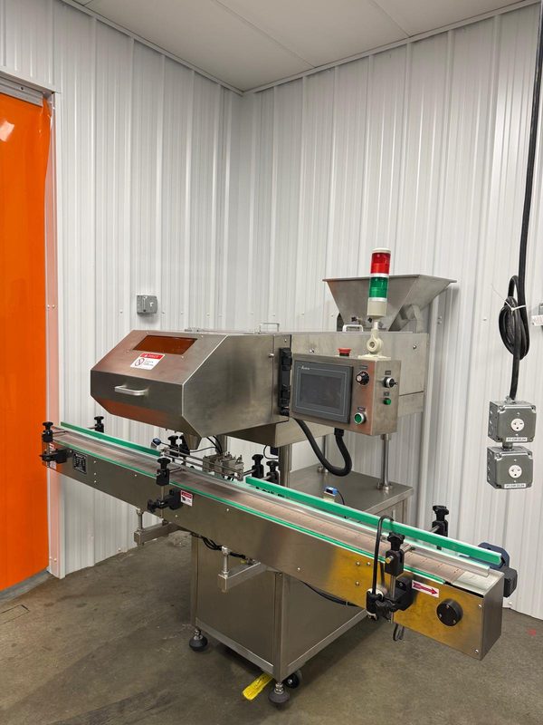 Metal detection unit inline on the bottling conveyor