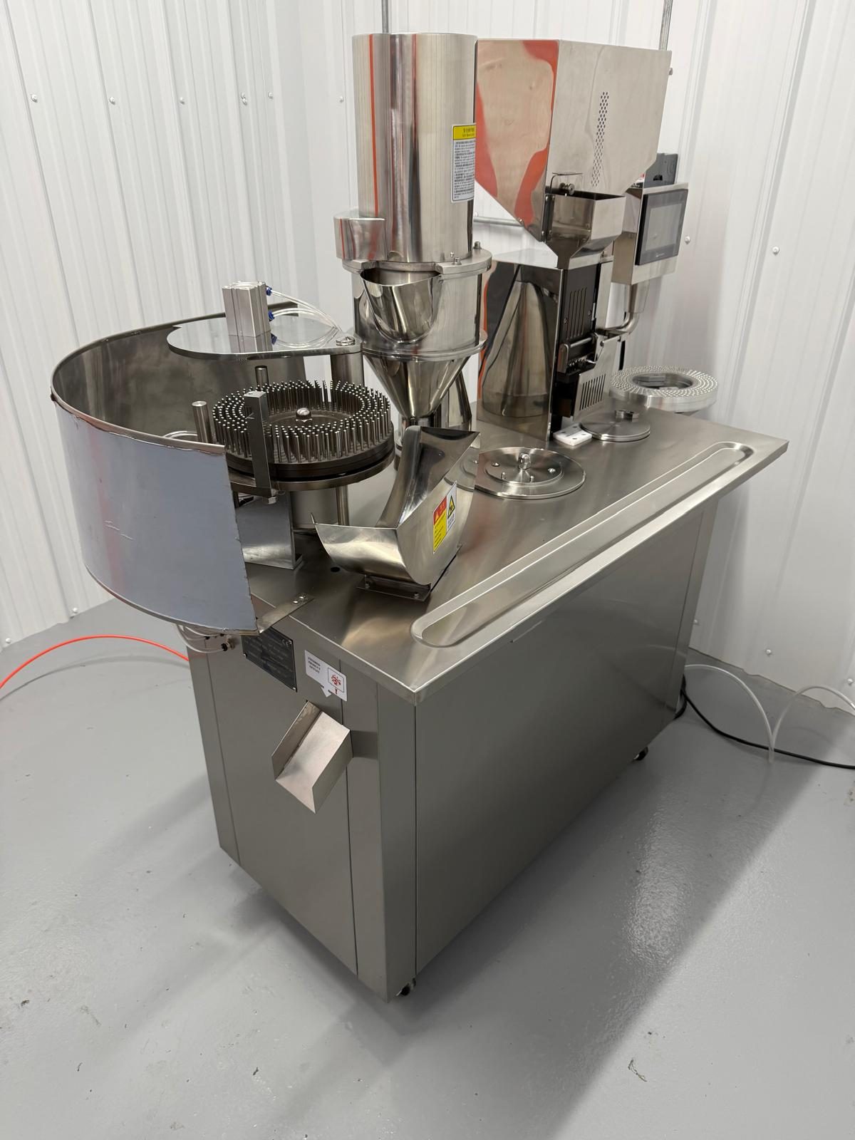Semi-automatic filling machine with a stainless product bowl